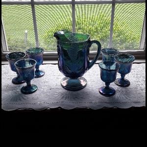 Carnival glass pitcher and 6 goblets